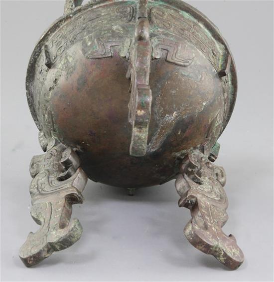 A Chinese archaic bronze tripod ritual food vessel, late Shang/early Western Zhou dynasty, 23cm high, repairs